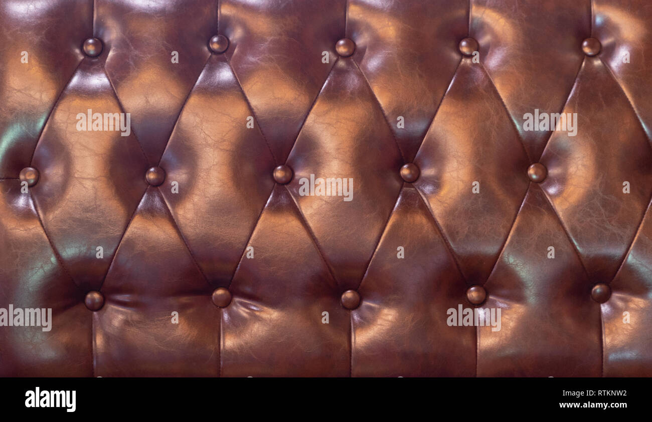 drak red Upholstery artificial leather with rivets Stock Photo