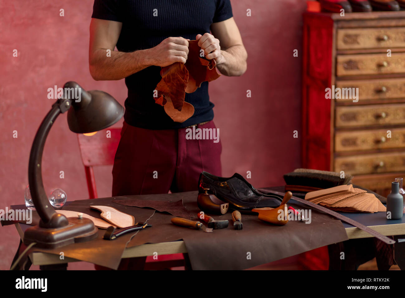 shoemaker working with leather cloth. close up cropped photo. lifestyle ...