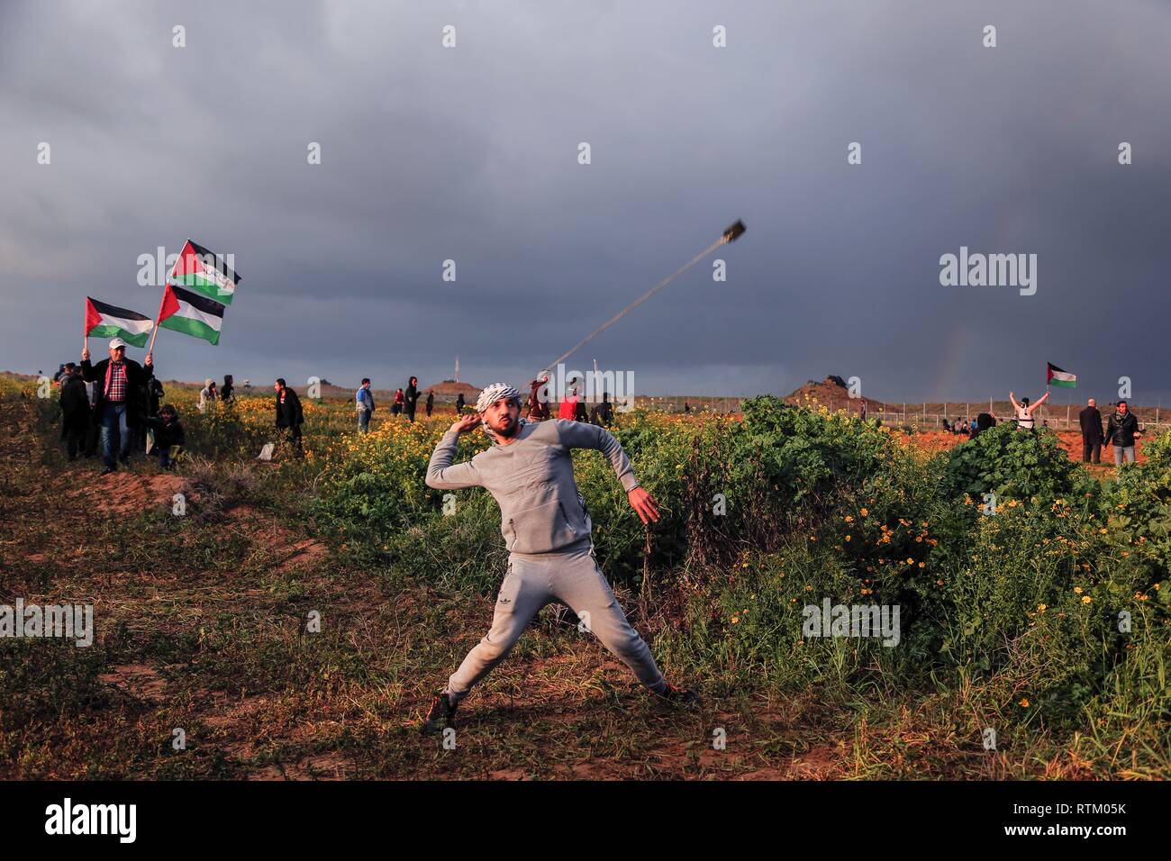 A Palestinian seen using a slingshot to hurl stones during a "Great