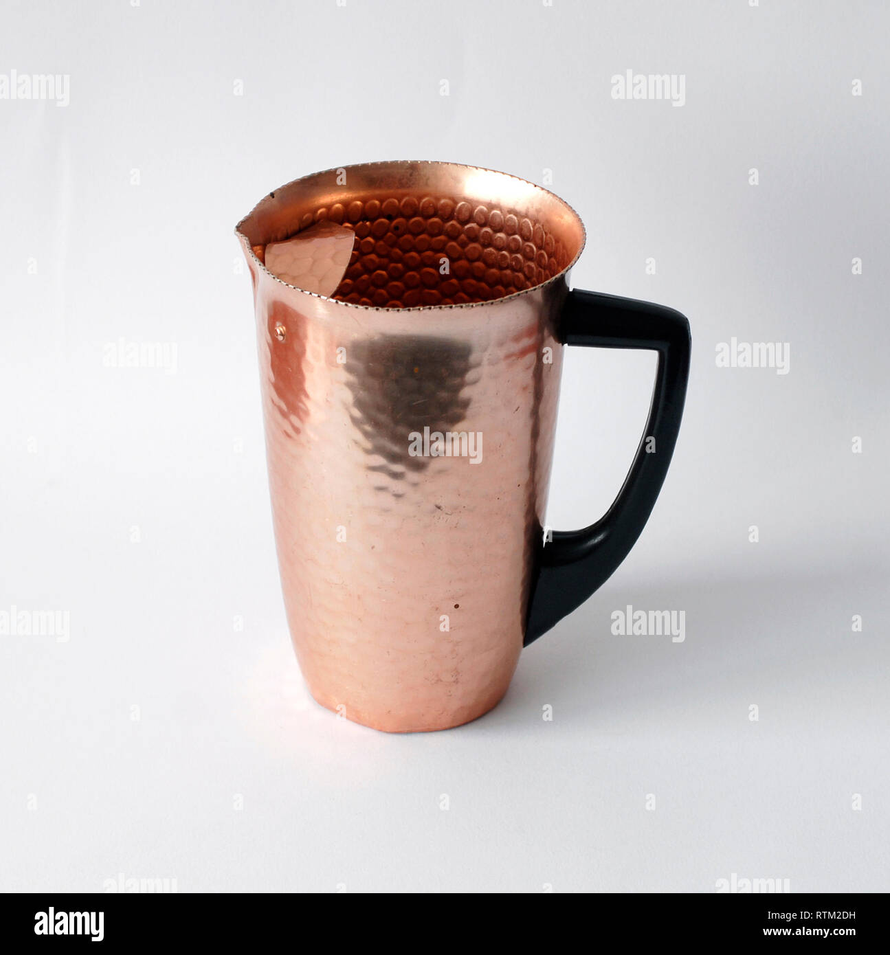 Vintage anodized aluminum jug, salmon color Stock Photo