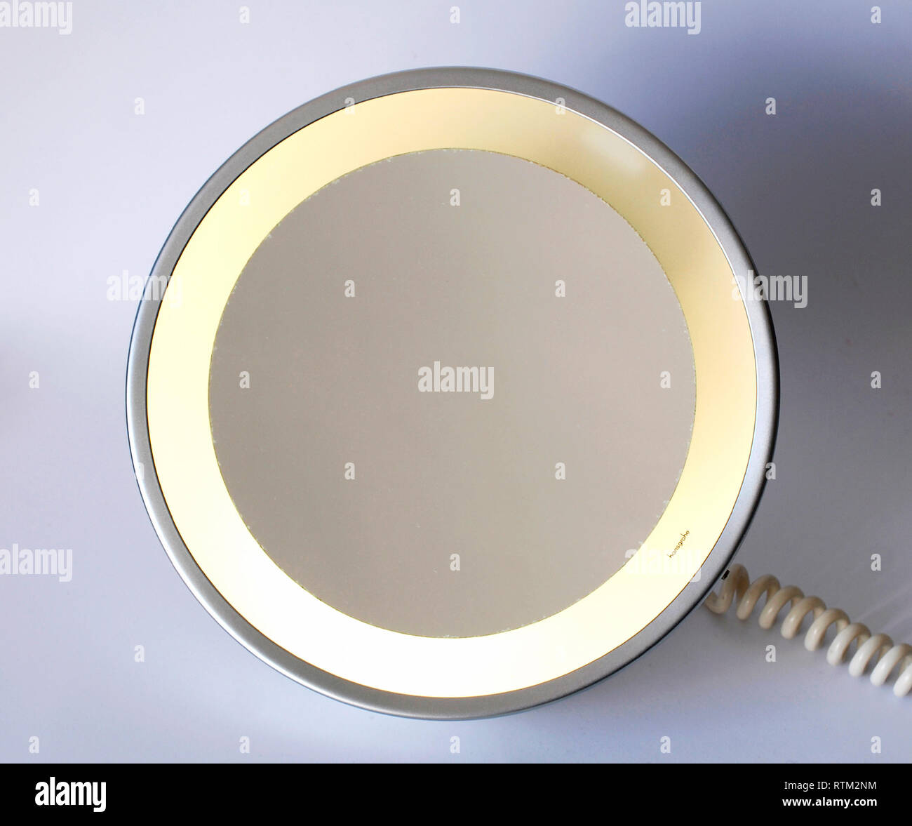 Round vintage mirror with magnification Stock Photo