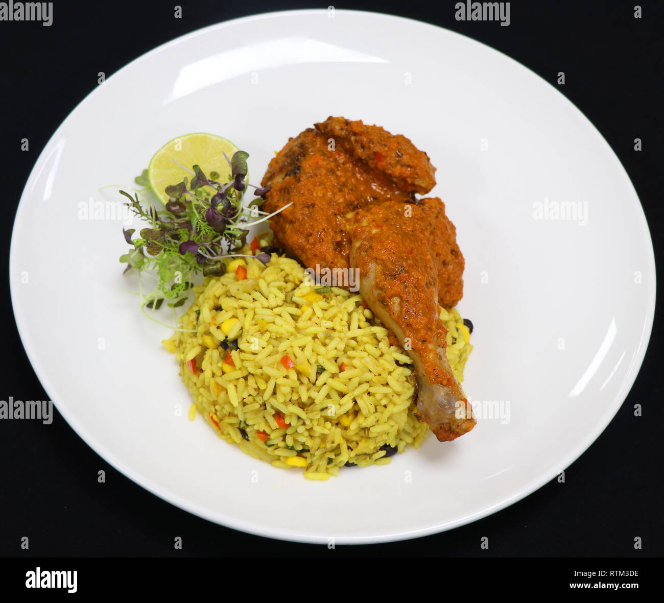 Durban style chicken with oporto rice Stock Photo Alamy