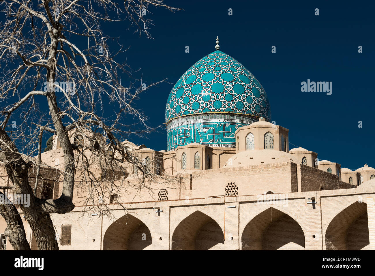 View of pilgrimage site with decorated dome of mosque complex Shah Nematollah Vali Shrine, Iran Stock Photo