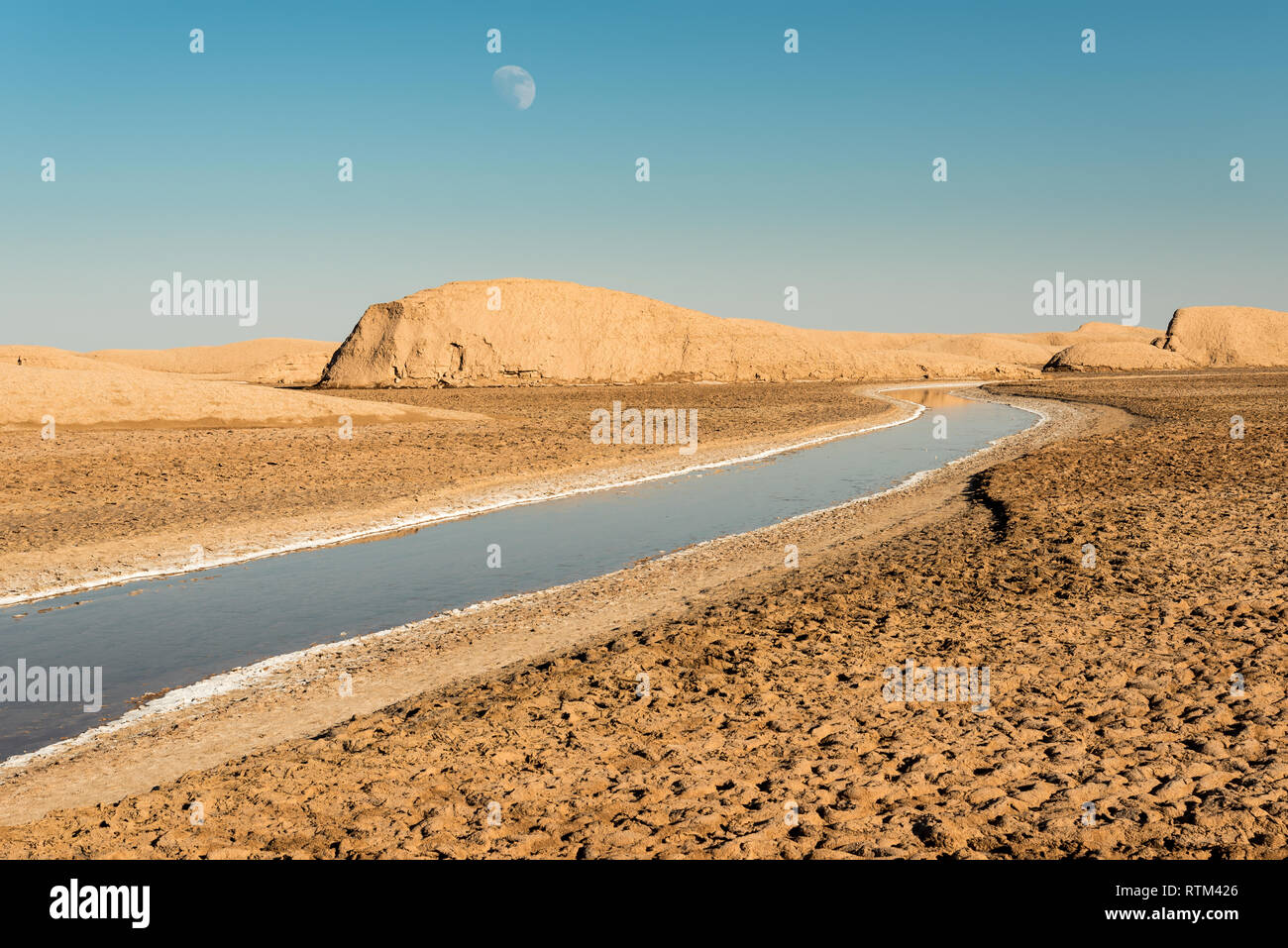 View of salt Rud-e Shur river inside egg  mountains, yardangs in Kaluts desert, part of Dasht-e Lut desert in province Kerman, Iran Stock Photo