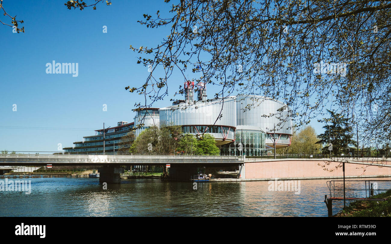STRASBOURG, FRANCE - APR 15, 2017: European Court of Human Rights building and Ill River in Strasbourg, France early in the morning on a spring day Stock Photo