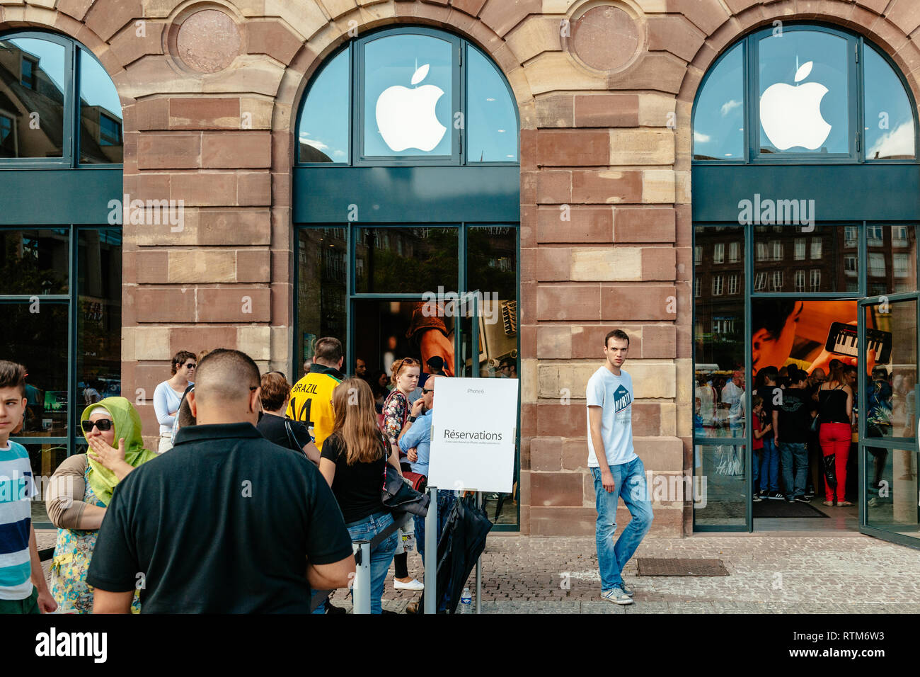 A Customer at an Apple Store Looking at His IPhone while Waiting at an Apple  Store Editorial Photo - Image of imac, computer: 237668441