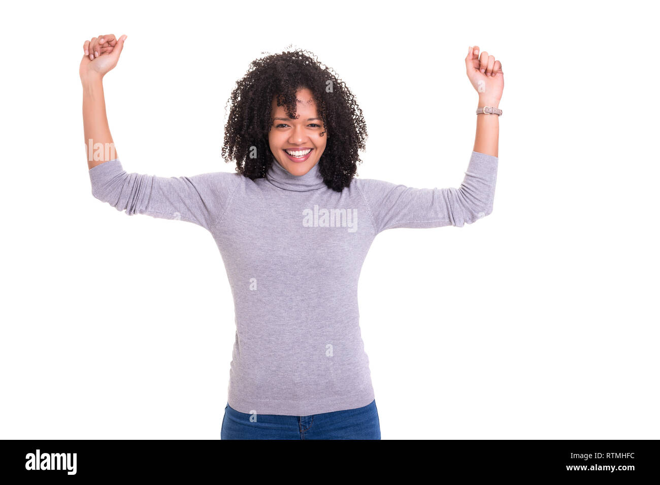 Studio shot of a Very Happy african woman with arms raised Stock Photo ...