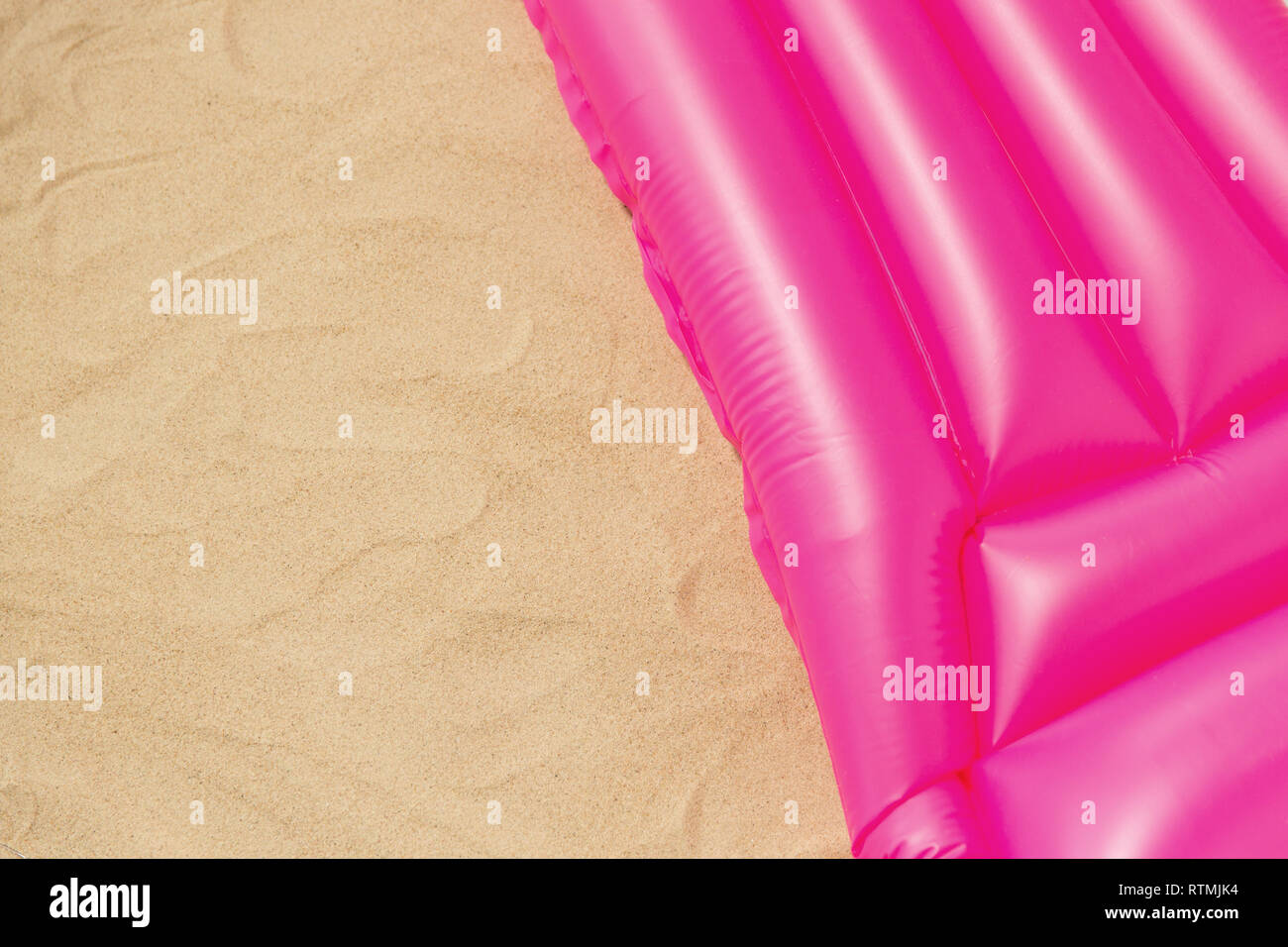 pink swimming mattress on beach Stock Photo Alamy