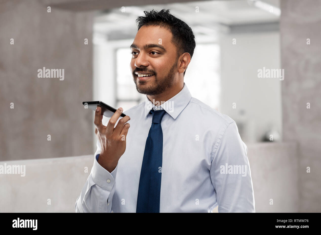 businessman using voice command on smartphone Stock Photo