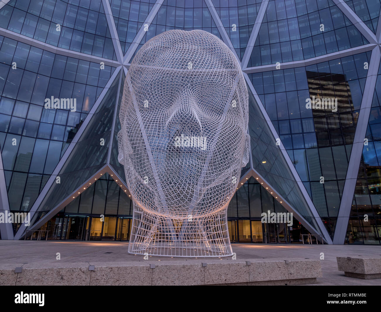 Wonderland sculpture by Jaume Plensa in the front of the Bow Tower on November 6, 2016 in Calgary, Alberta, Canada. Jaume Plensa is a Catalan Spanish Stock Photo