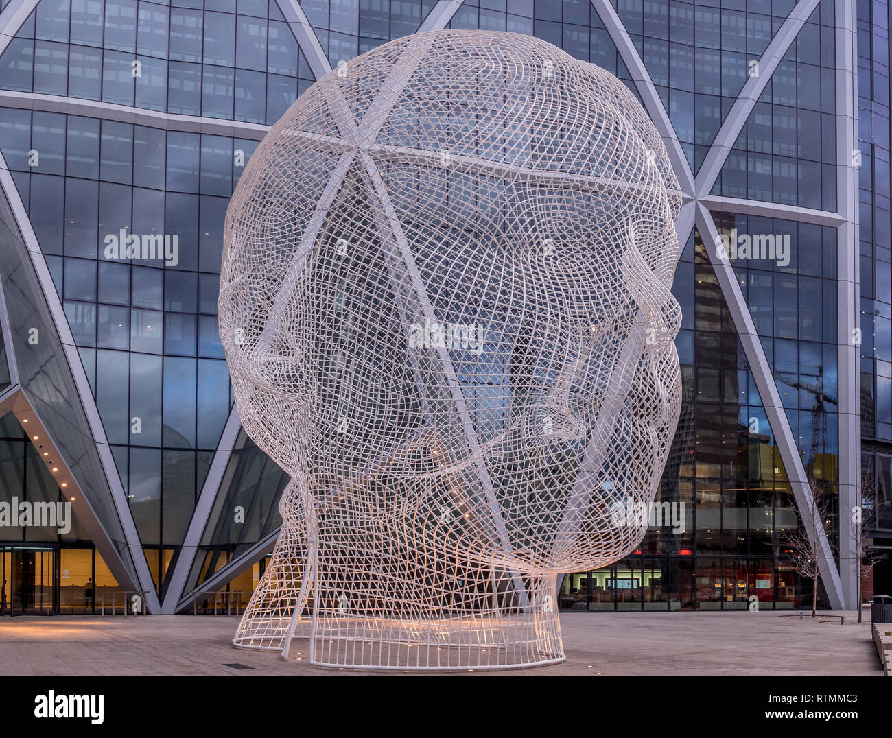 Wonderland sculpture by Jaume Plensa in the front of the Bow Tower on November 6, 2016 in Calgary, Alberta, Canada. Jaume Plensa is a Catalan Spanish Stock Photo