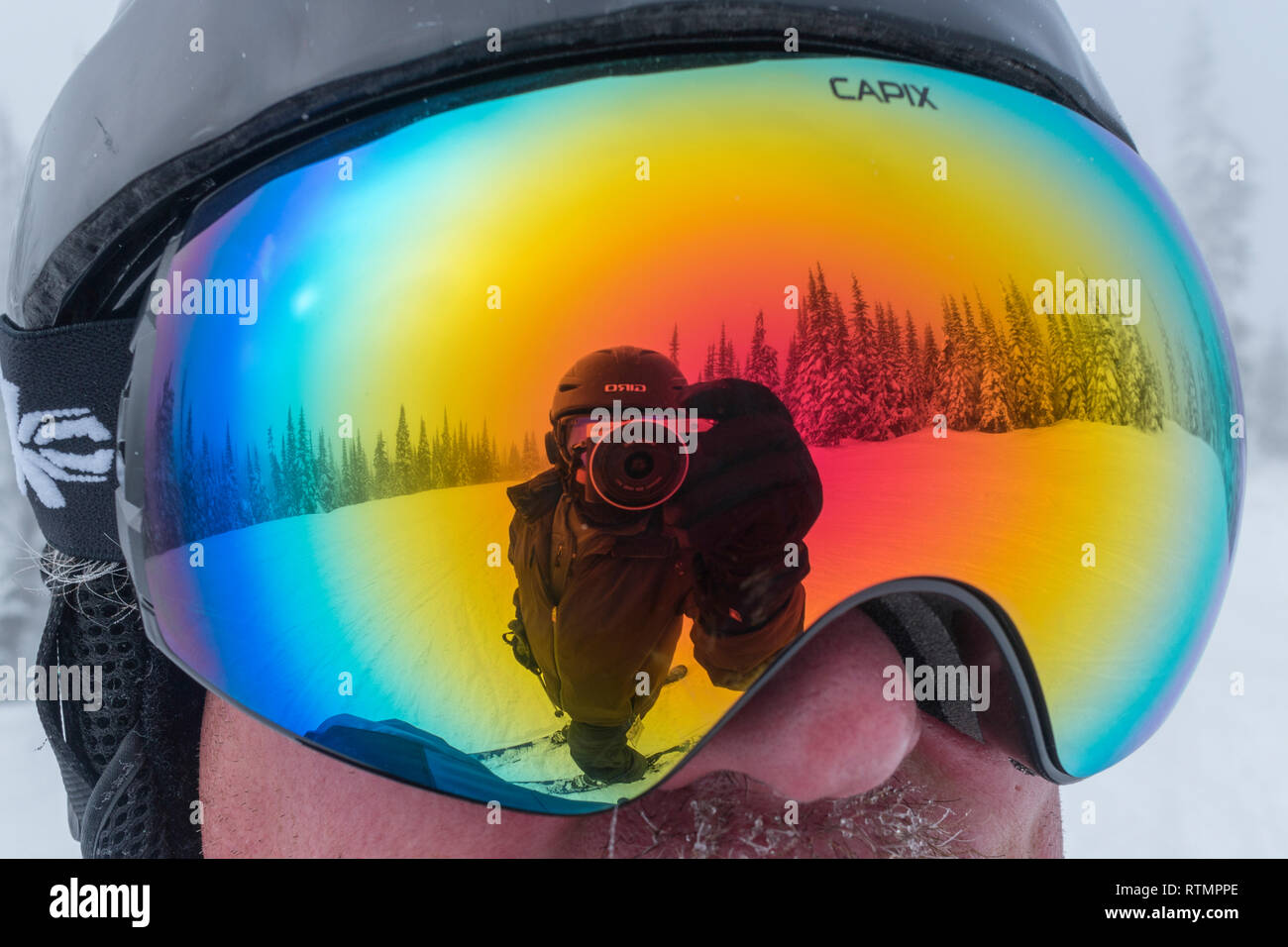 Reflection of a photographer on the ski goggle, Sun Peaks Resort, Sun Peaks, Kamloops, British Columbia, Canada Stock Photo