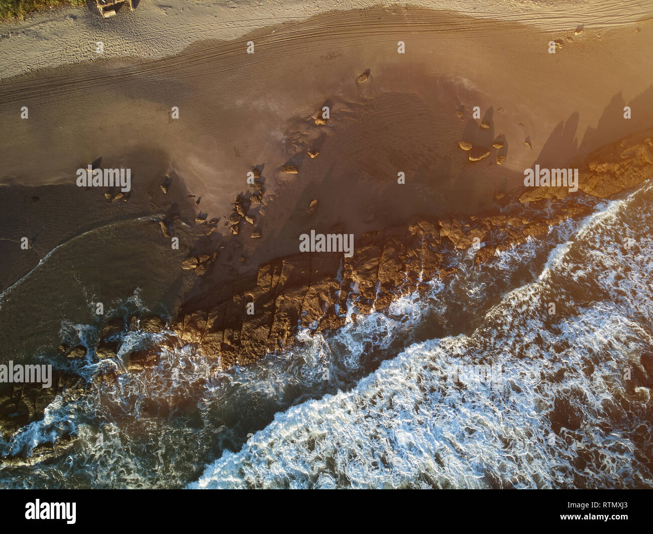 Ocean shore in sunset time aerial drone above  view Stock Photo