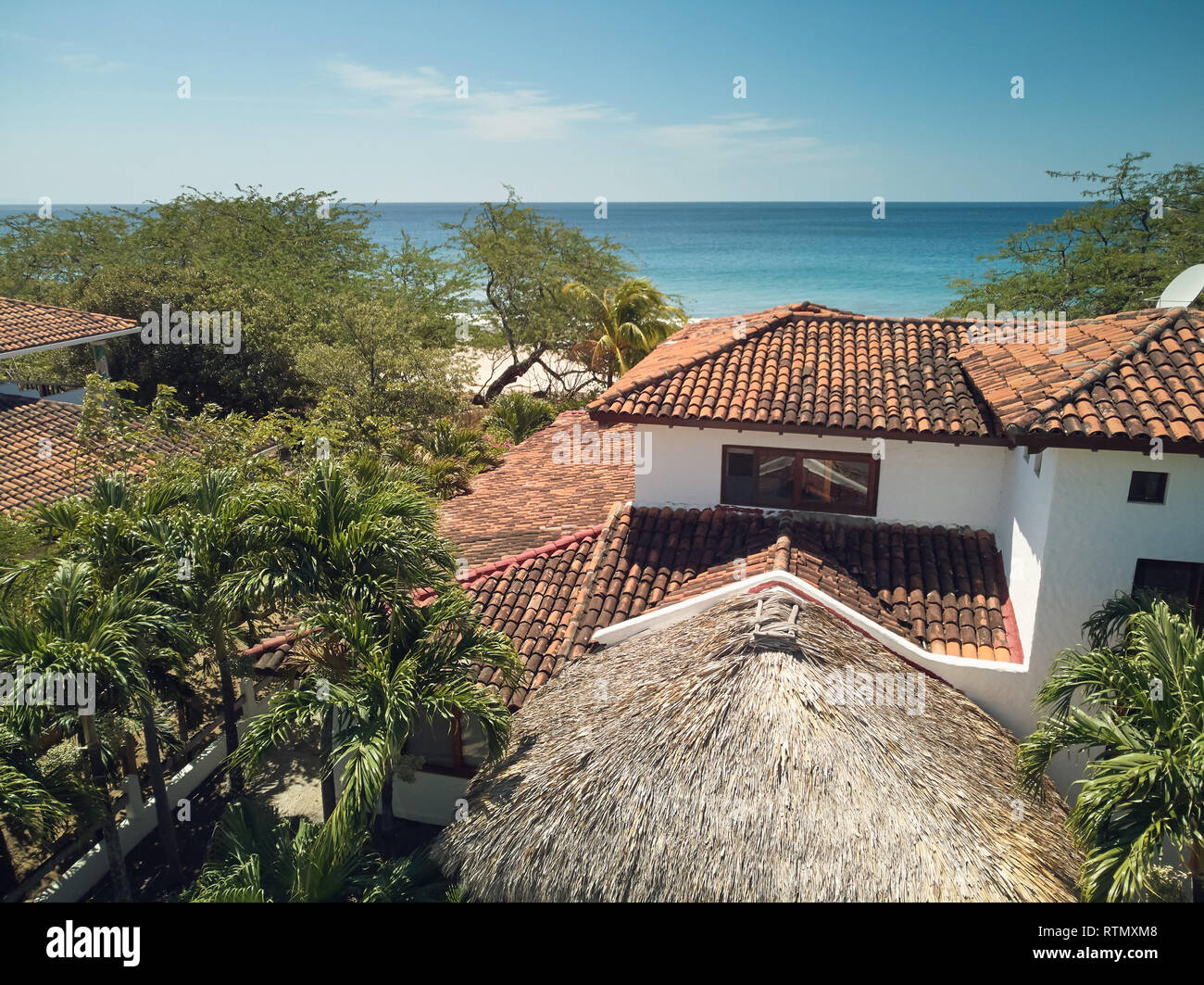 Red roof of luxury villa house aerial drone view Stock Photo