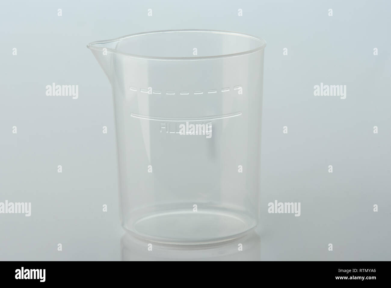 Clear empty cup with fill line isolated on white background Stock Photo