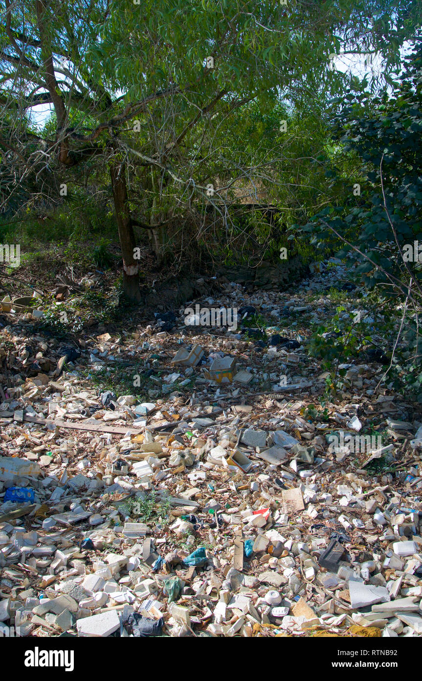 Huge open-air garbage landfill in a riverbed near Sihanoukville, Cambodia Stock Photo