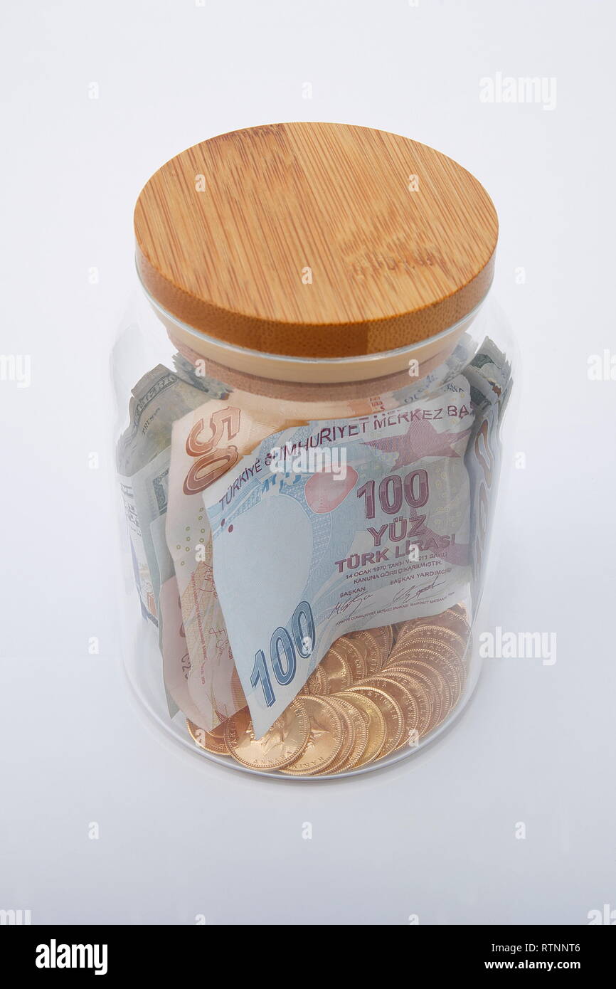 View of golden coins and banknotes, in jar on white background Stock ...