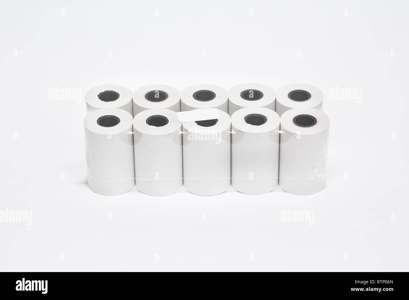 Roll of cash register tape isolated on soft gray background.High