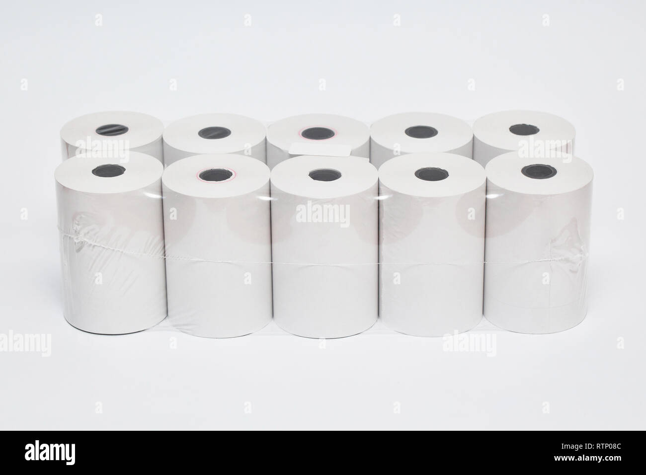 Roll of cash register tape isolated on soft gray background.High