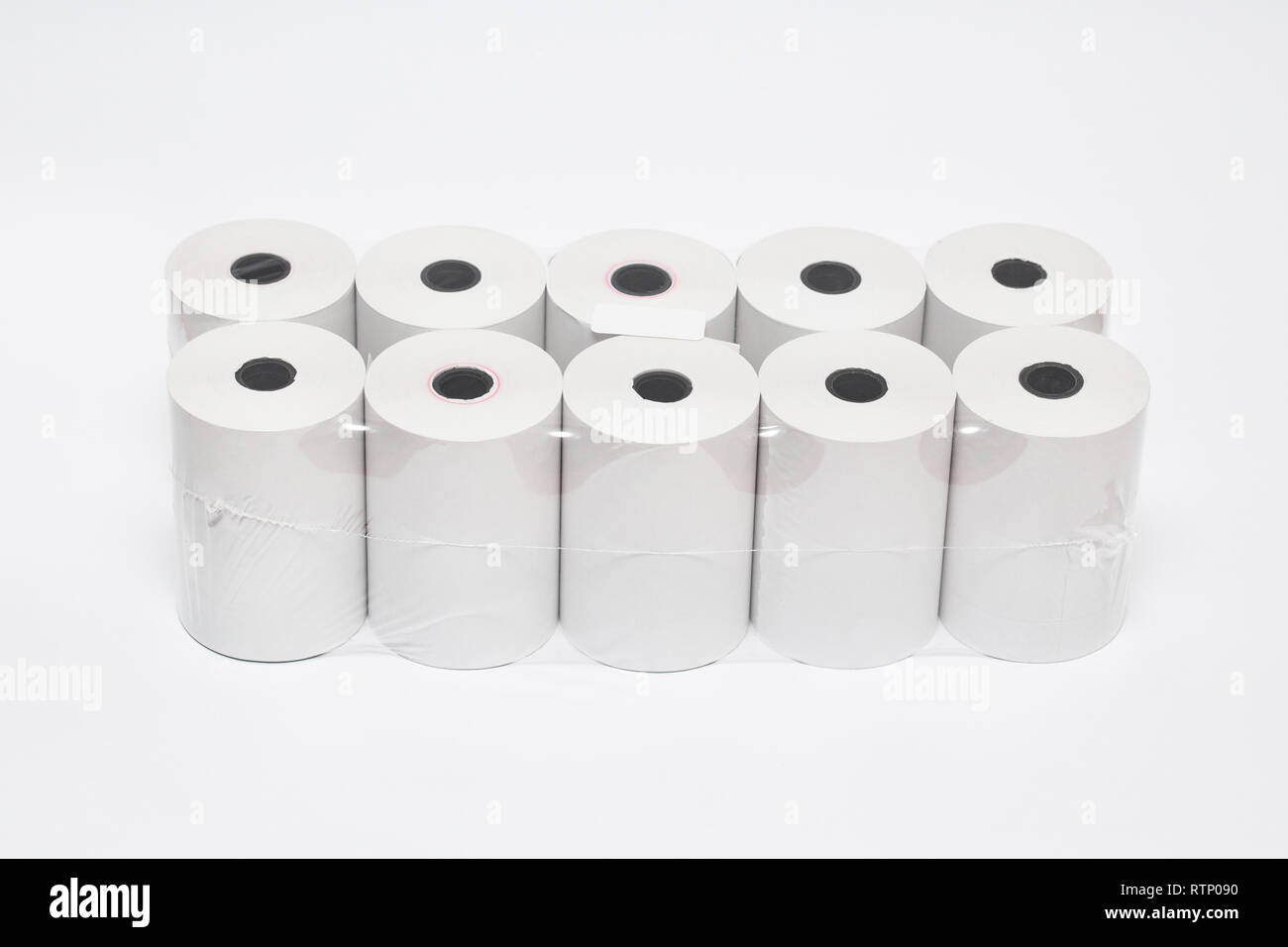 Roll of cash register tape isolated on soft gray background.High