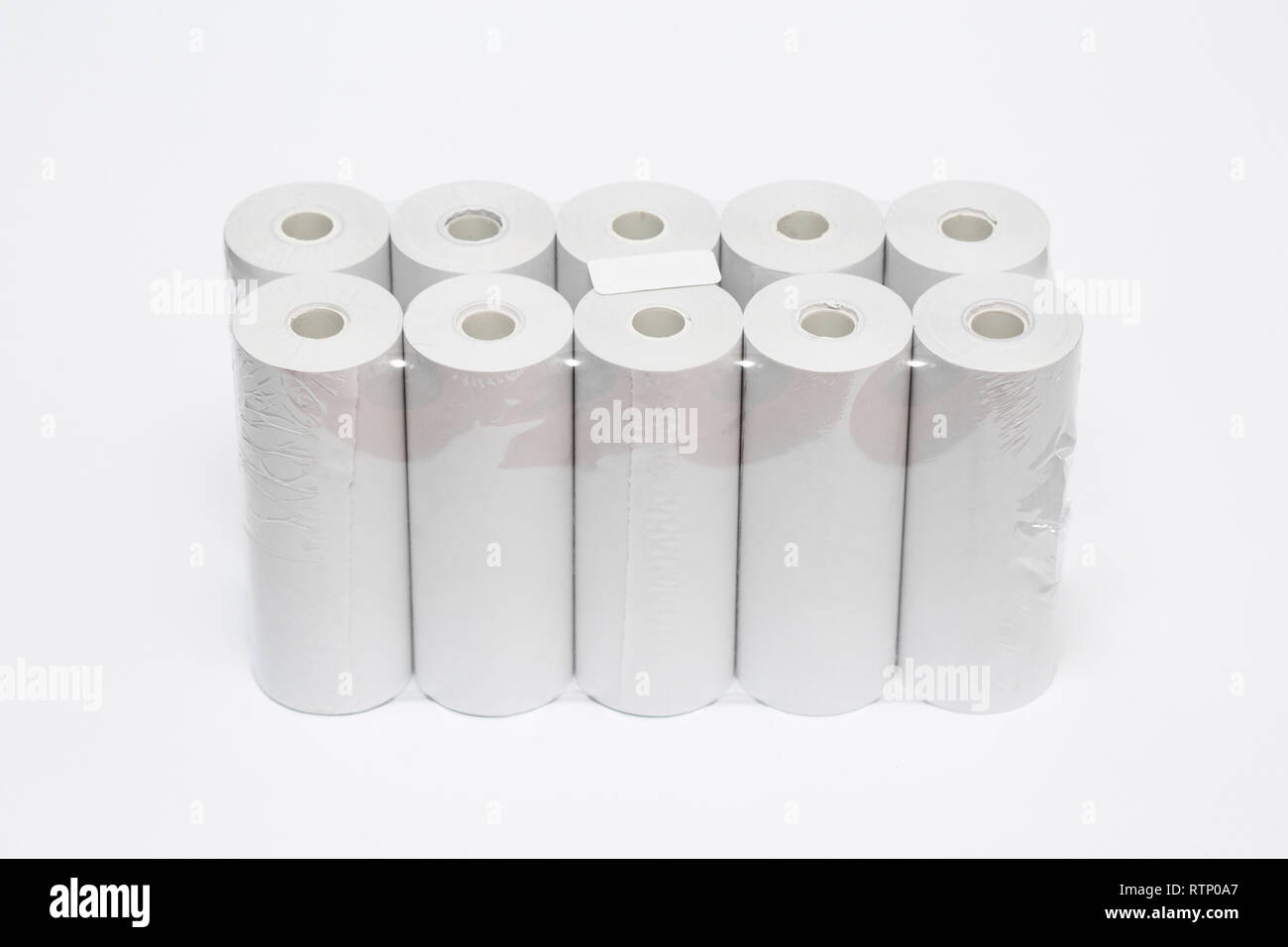 Roll of cash register tape isolated on soft gray background.High