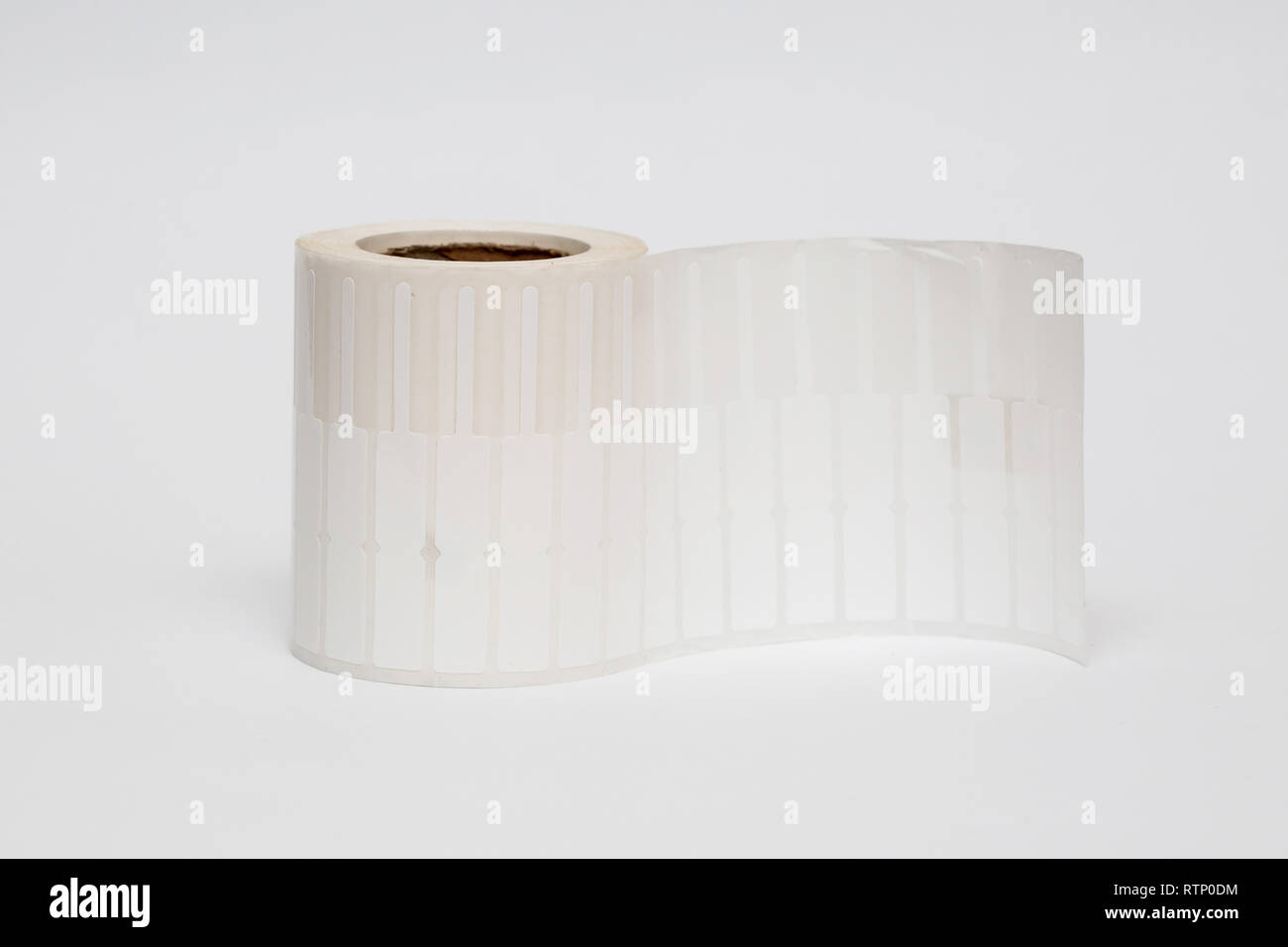 Roll of cash register tape isolated on soft gray background.High
