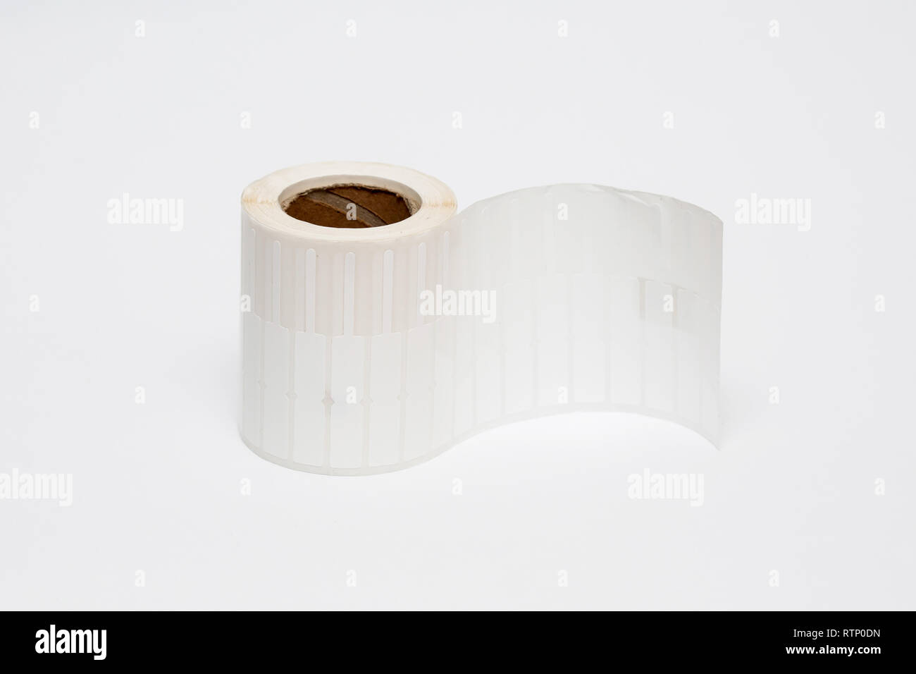 Roll of cash register tape isolated on soft gray background.High