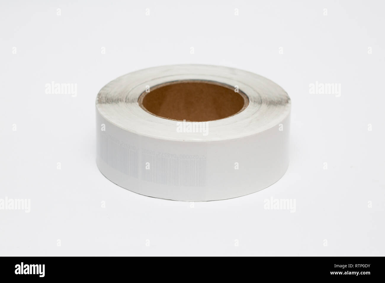 Roll of cash register tape isolated on soft gray background.High