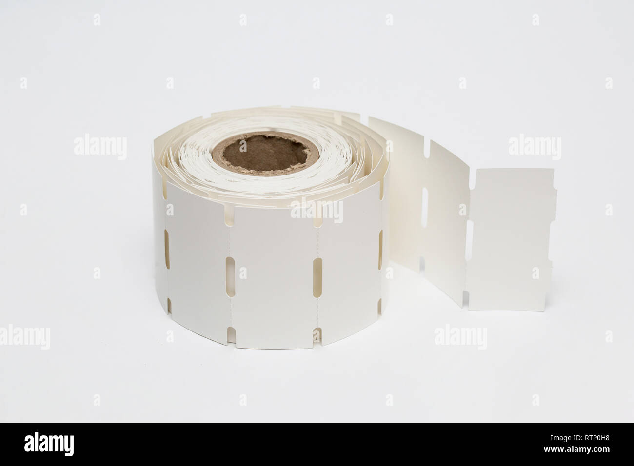 Roll of cash register tape isolated on soft gray background.High