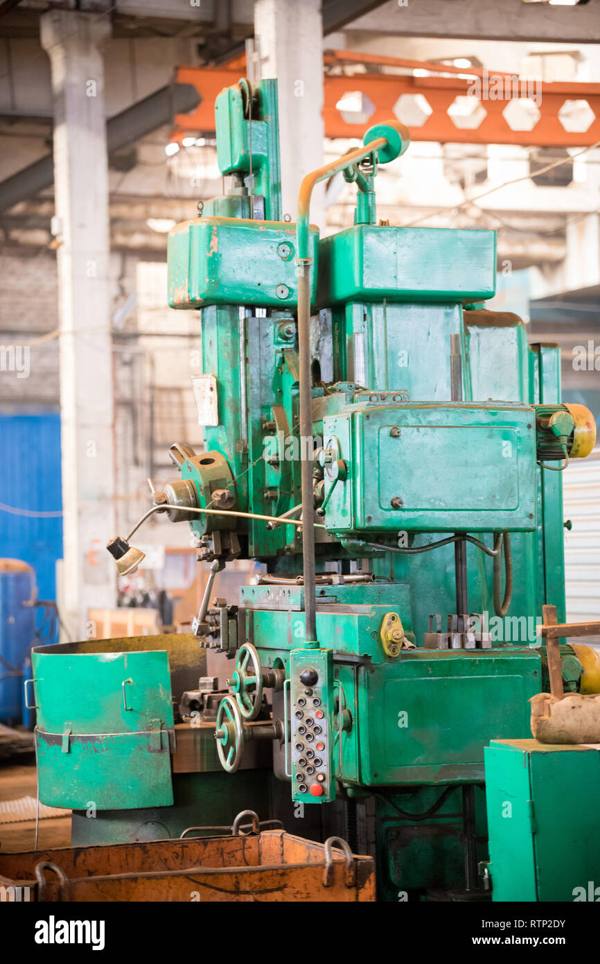 Industrial concept. A green construction machine in the plant Stock ...