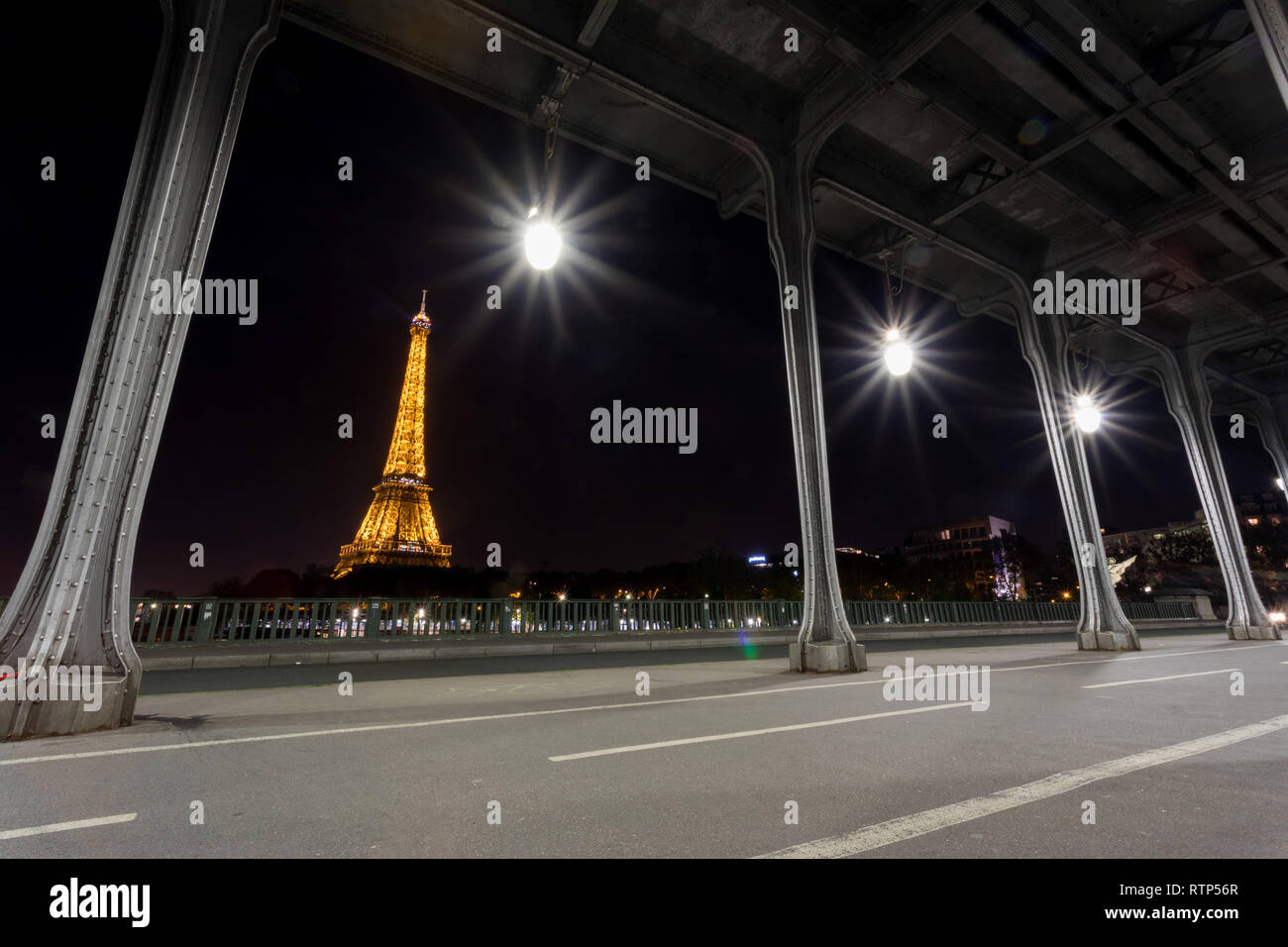 Paris, France - October 9, 2018: View of the eiffel tower at night from the Bir-Hakeim bridge Stock Photo