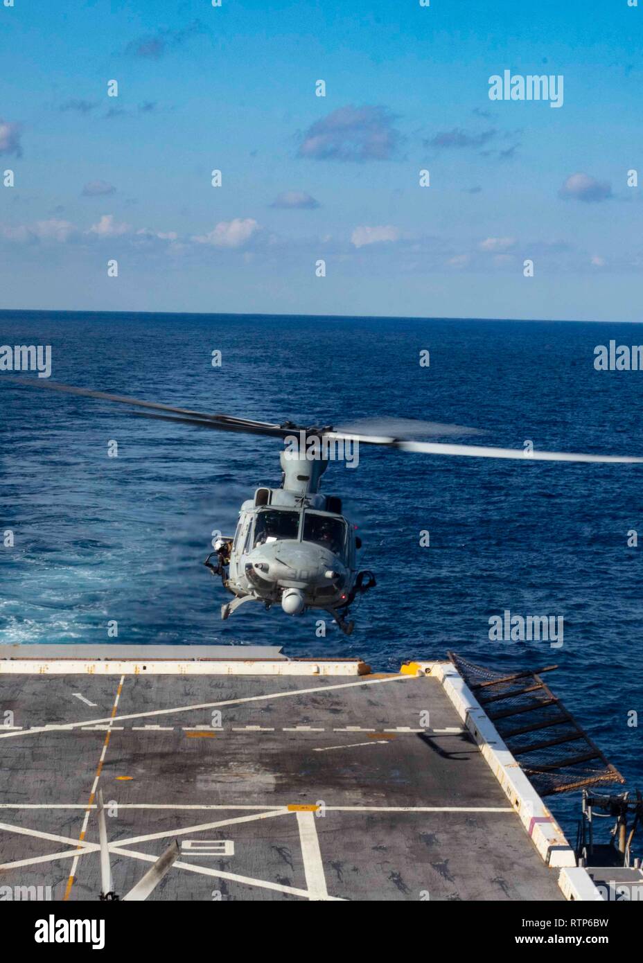 190226-N-HG389-0079 MEDITERRANEAN SEA (Feb. 26, 2019) A UH-1Y Huey helicopter assigned to the “Black Knights” of Marine Medium Tiltrotor Squadron (VMM) 264 (Reinforced) lands on the flight deck of the San Antonio-class amphibious transport dock ship USS Arlington (LPD 24), Feb. 26, 2019. Arlington is on a scheduled deployment as part of the Kearsarge Amphibious Ready Group in support of maritime security operations, crisis response and theater security cooperation, while also providing a forward naval presence. (U.S. Navy photo by Mass Communication Specialist 2nd Class Brandon Parker/Released Stock Photo