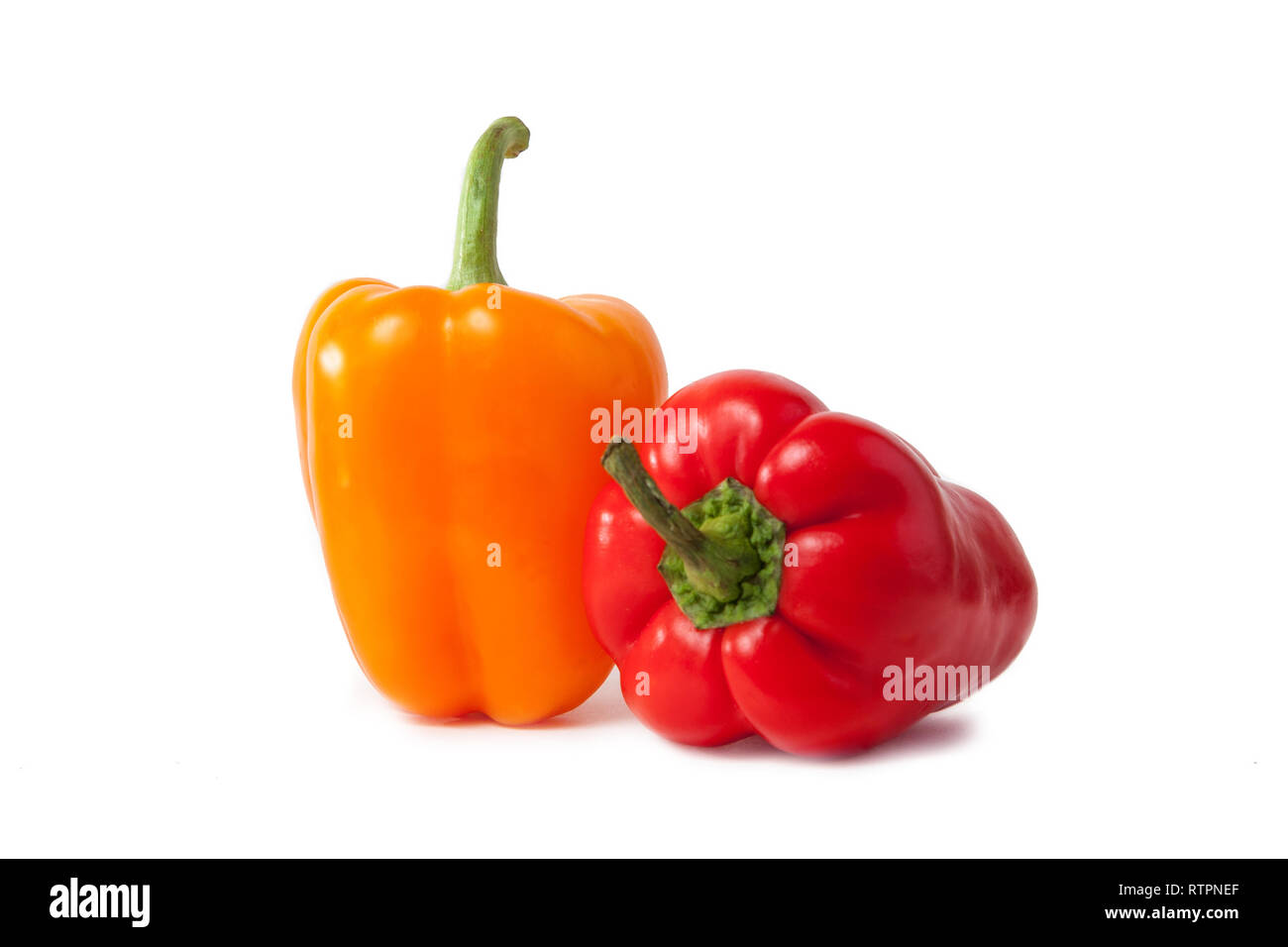 Red and yellow pepper on white background Stock Photo - Alamy