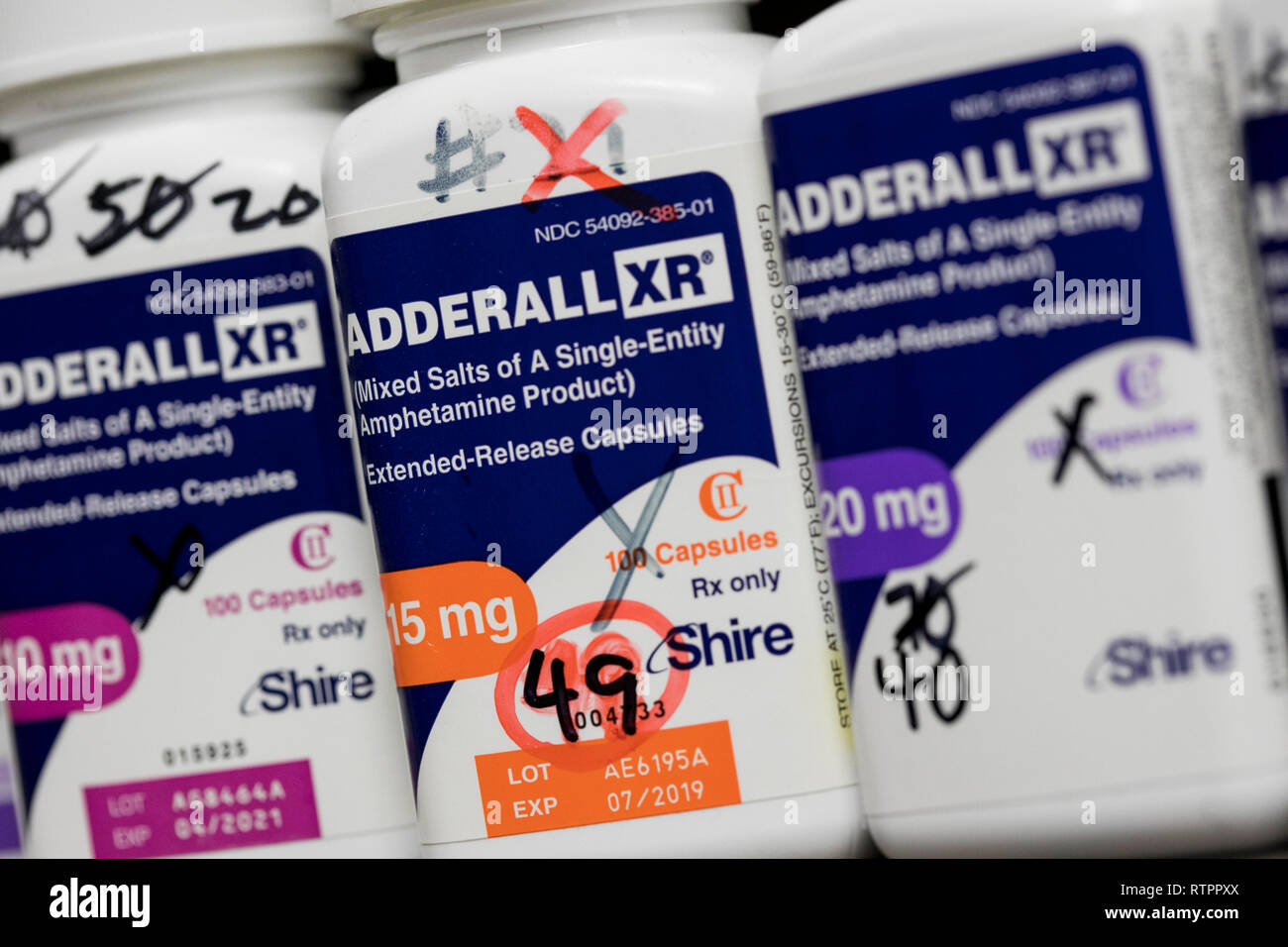 Bottles of Adderall XR prescription pharmaceuticals photographed in a pharmacy. Stock Photo
