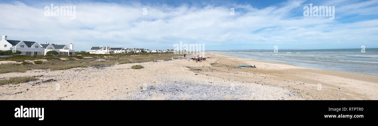panorama of a typical West Coast holiday village or town made up of white beach houses stretching along the seafront and 40km of white sand and sea Stock Photo