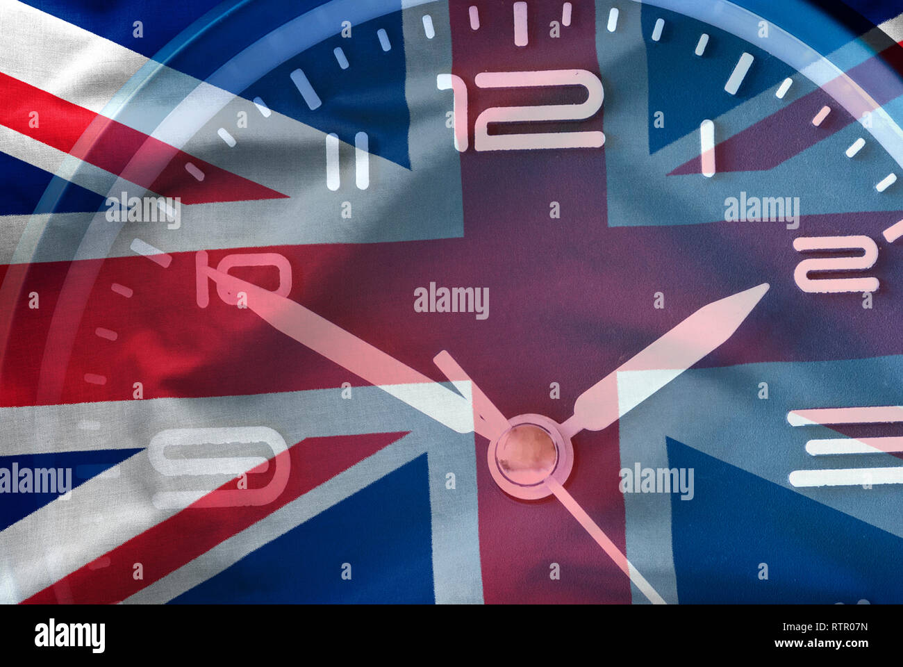 Composite image of the British flag and a clock face in a conceptual image of the countdown to Brexit when Britain leaves the EU Stock Photo