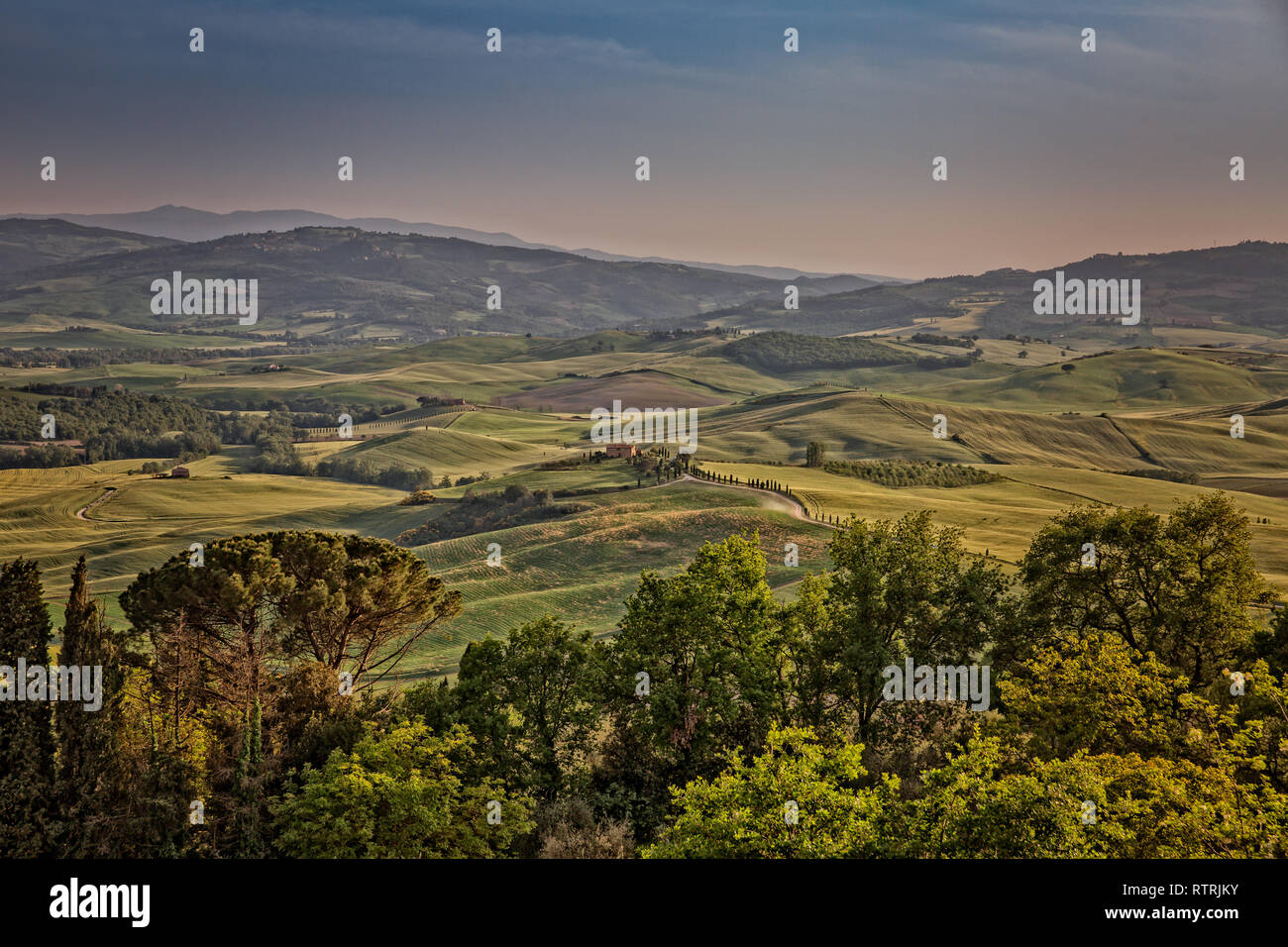 Rolling hills in Tuscany on a sunny day with dramatic clouds Stock Photo -  Alamy