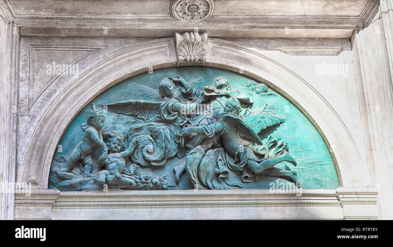 Saint Roch cathedral sculpture of angels above the entrance Stock Photo ...