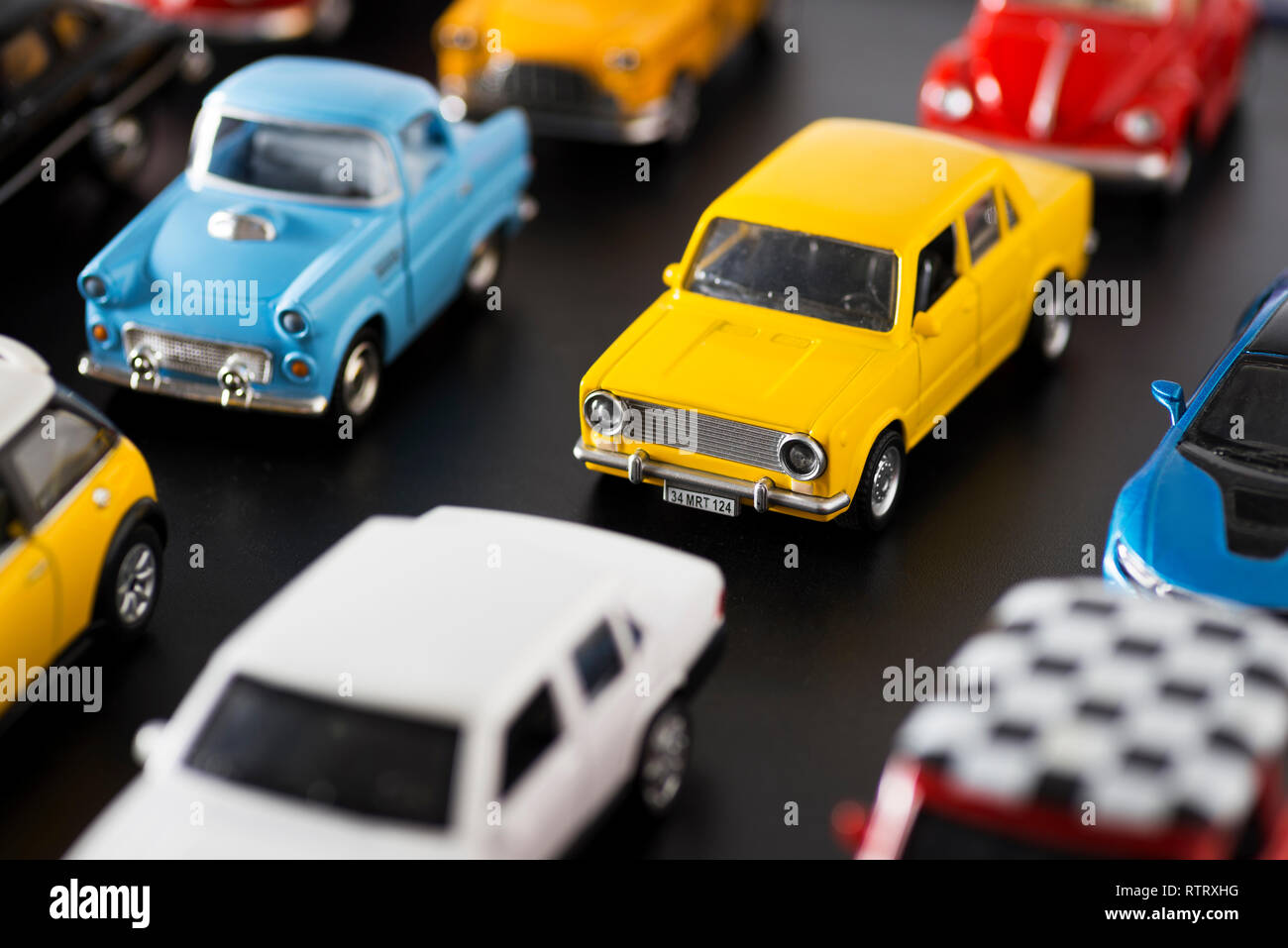 Izmir, Turkey - April  18, 2018: Various some brand toy cars on a black ground, looks like a traffic jam on the road. Stock Photo