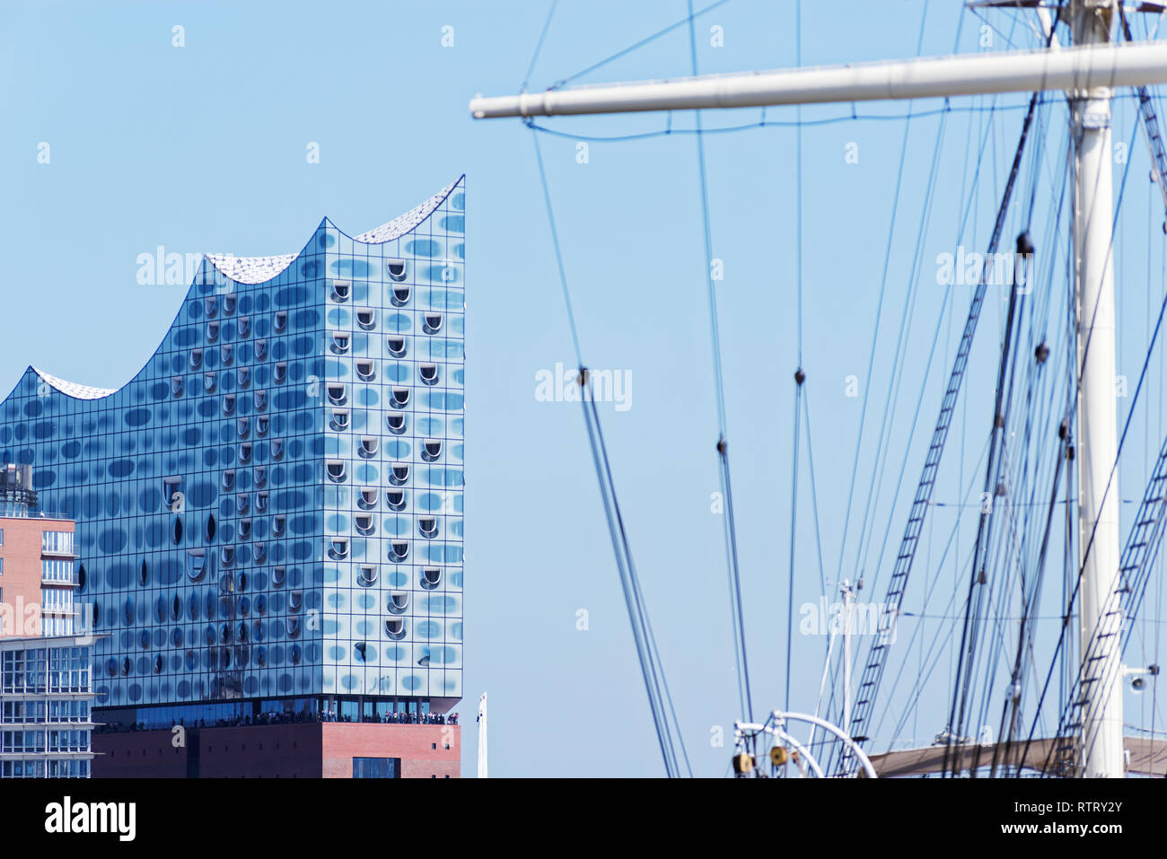 Hamburg, Germany - 27 June, 2018: Elbphilharmonie or so-called 'Elphi' - Elbe Philharmonic Hall in the harbor of Hamburg against clear blue sky and th Stock Photo