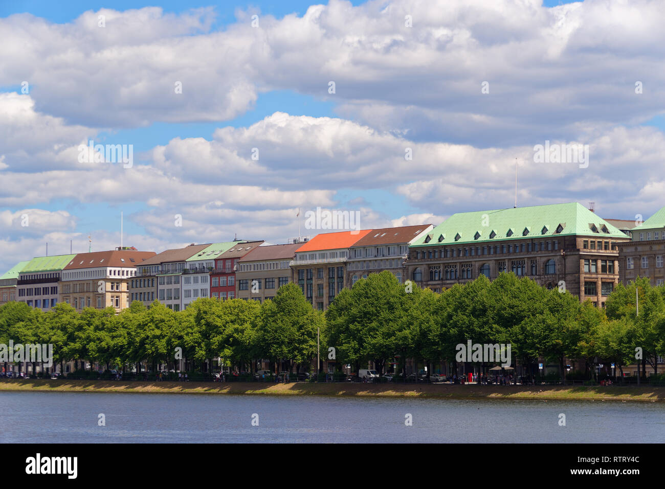 Hamburg, Germany - 30 June, 2018: Colorful roofs of buildings on Ballindamm, Jungfernstieg against blue cloudy sky Stock Photo
