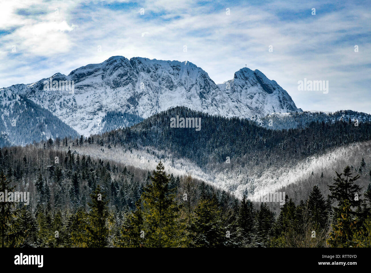 Winter in mountains. The picture was taken in Zakopane (Poland) in February 2019. Mount Giewont. Stock Photo