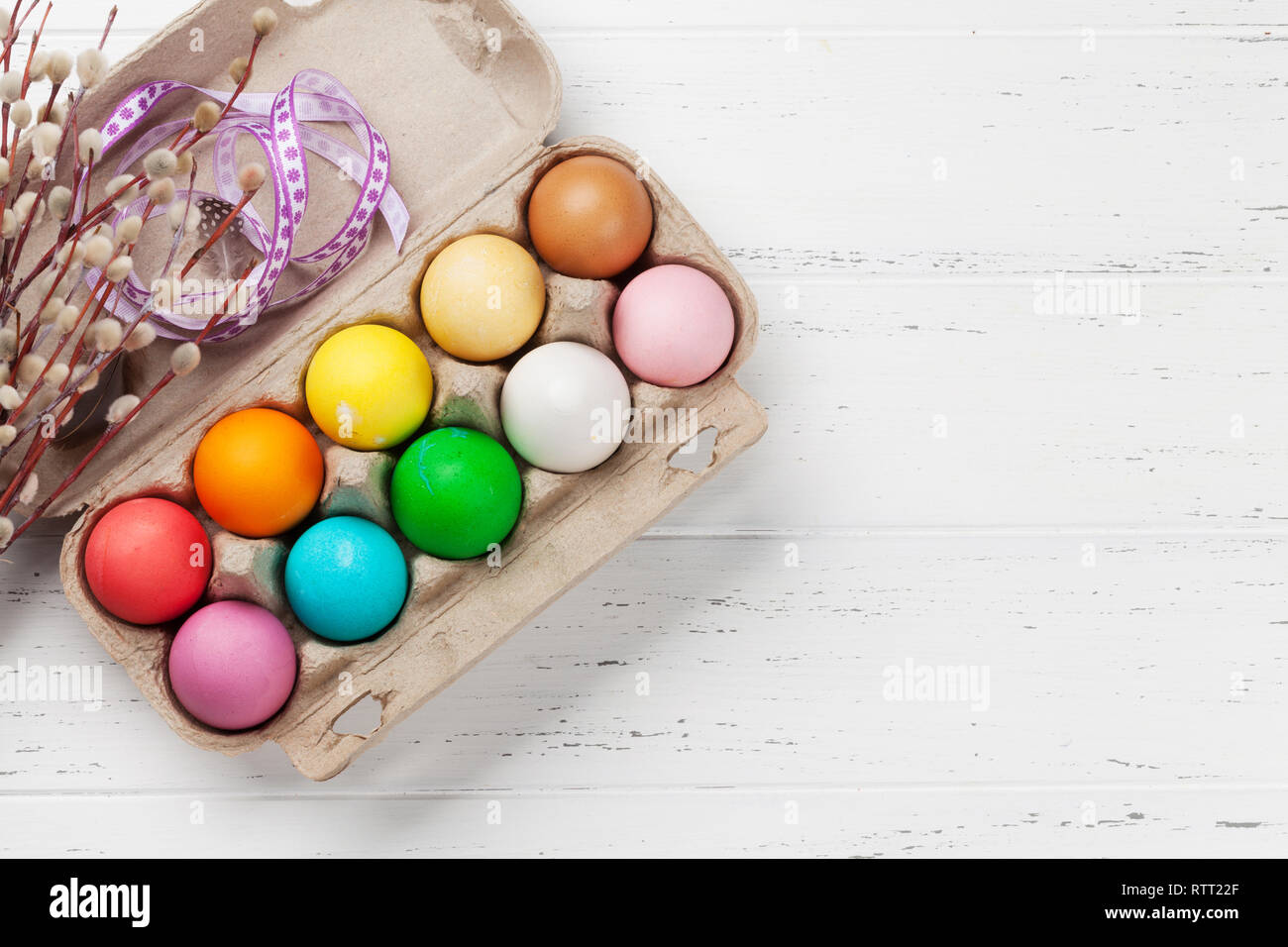 Easter greeting card with colorful easter eggs on wooden table. Top ...