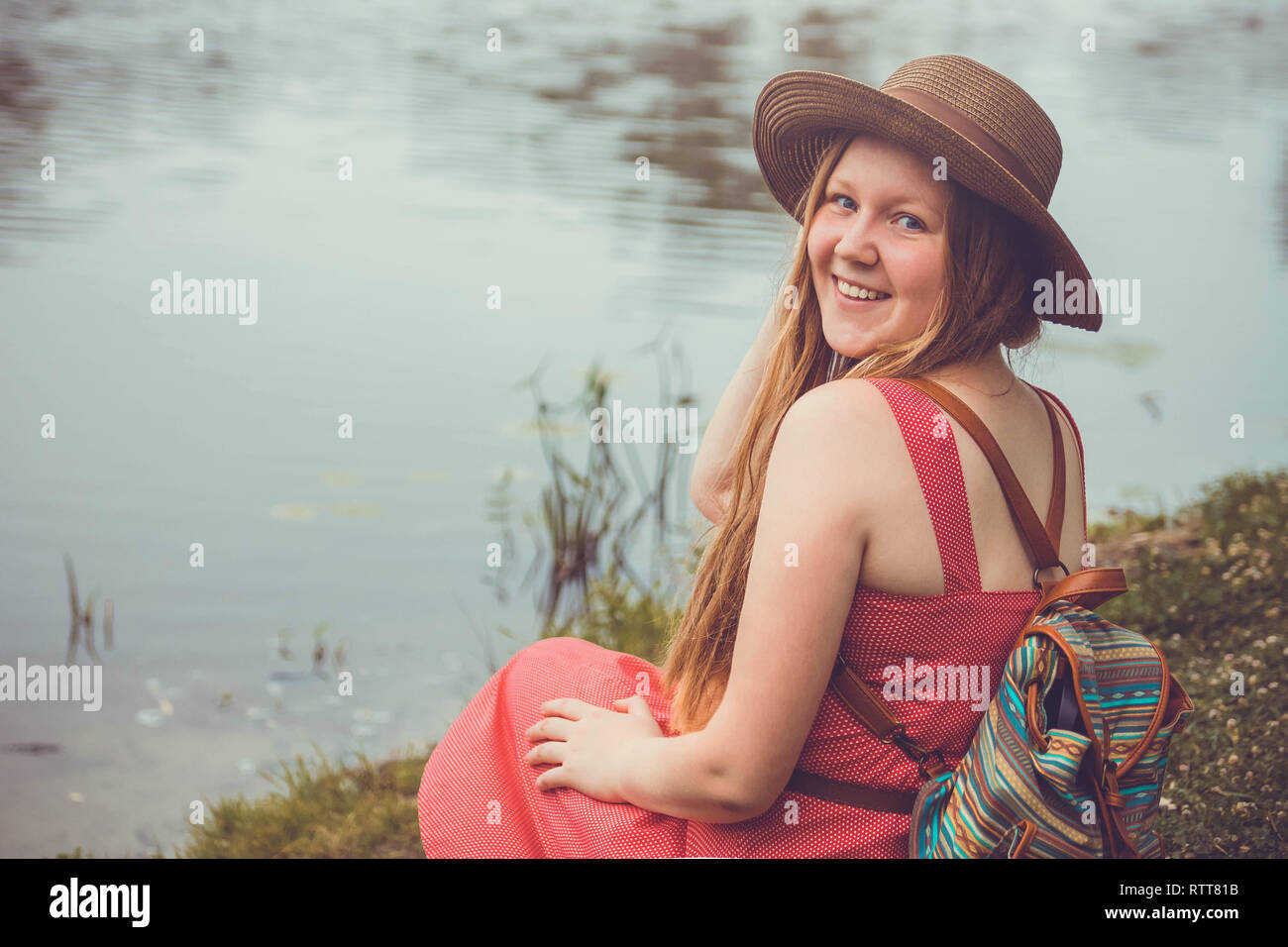 Girl traveler backpack sits hi-res stock photography and images - Alamy