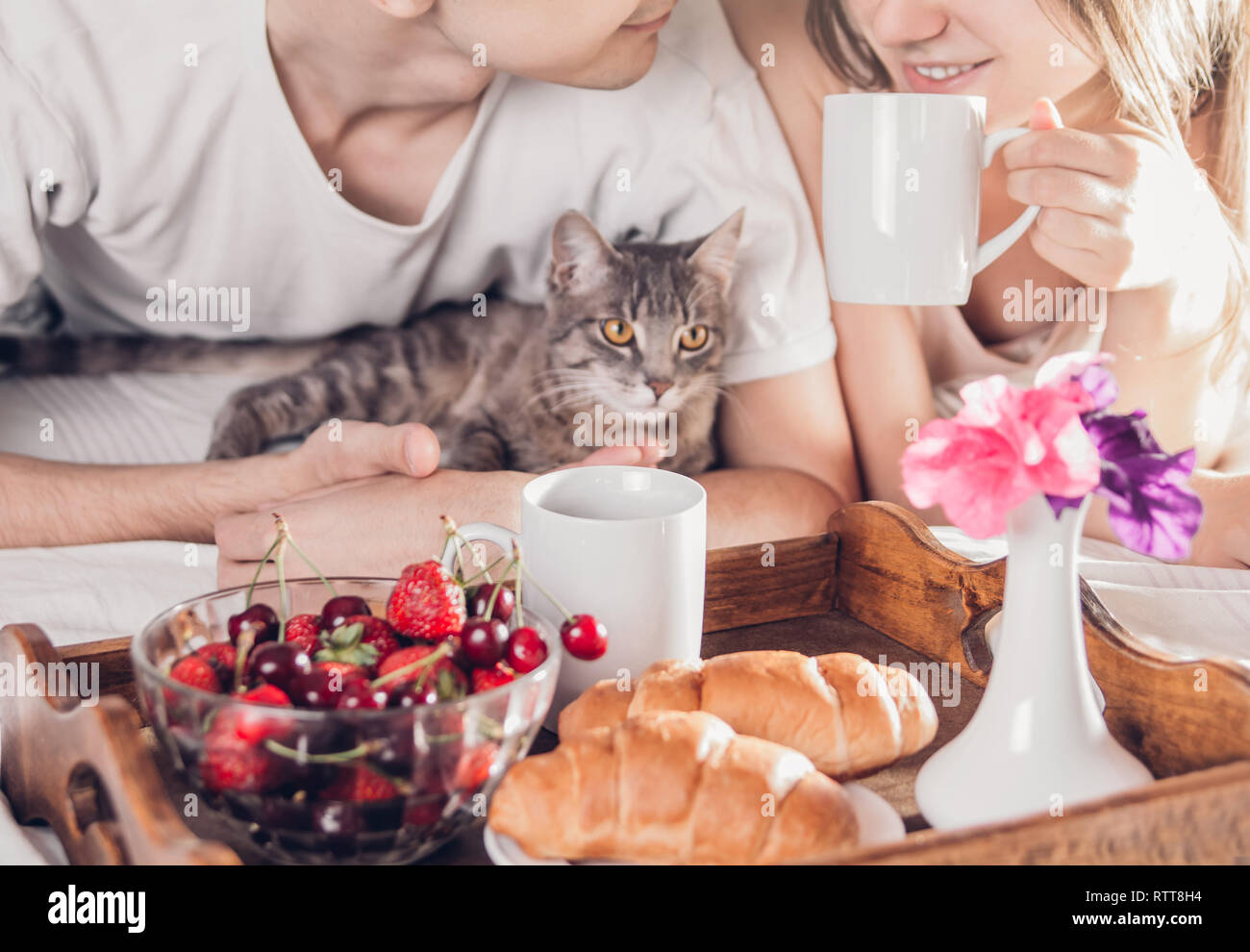 Couple in love having breakfast in bed Stock Photo