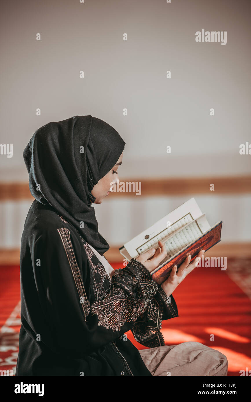 Three muslim girls reading Quran in mosque Stock Photo | Adobe Stock