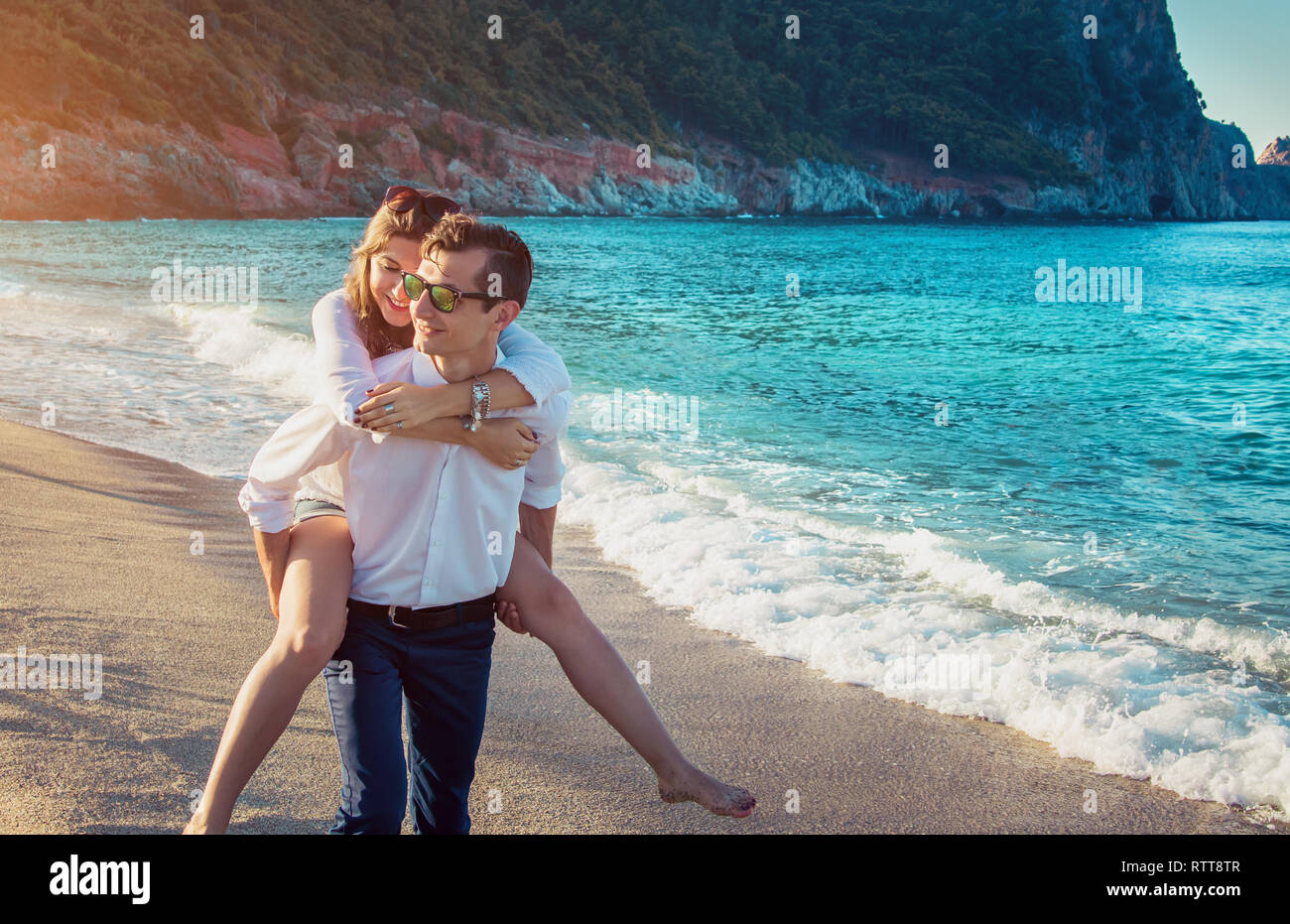 Young happy couple having fun on tropical beach in the morning Stock ...