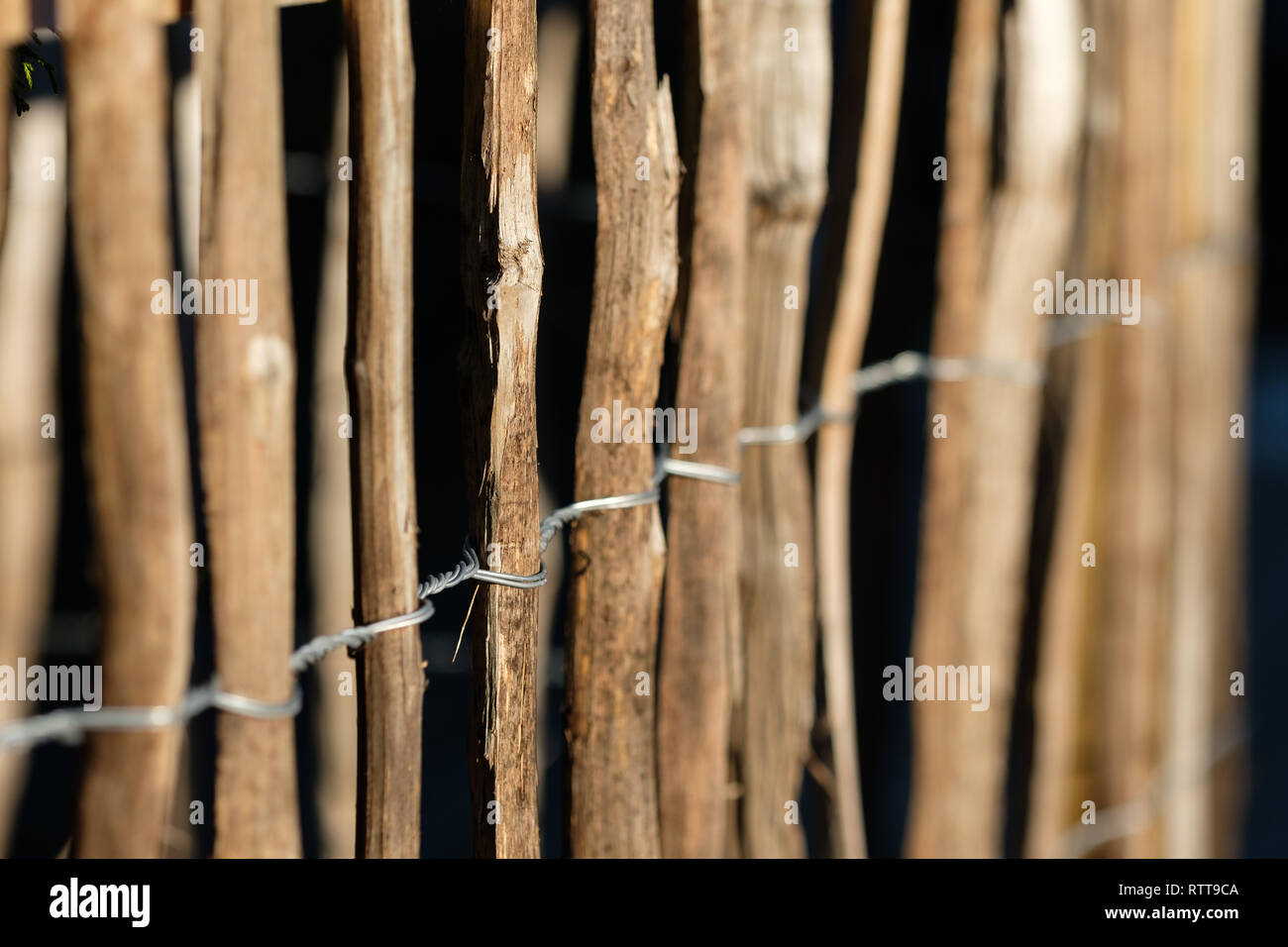 Wooden Battens of a fence fixed with wire Stock Photo Alamy