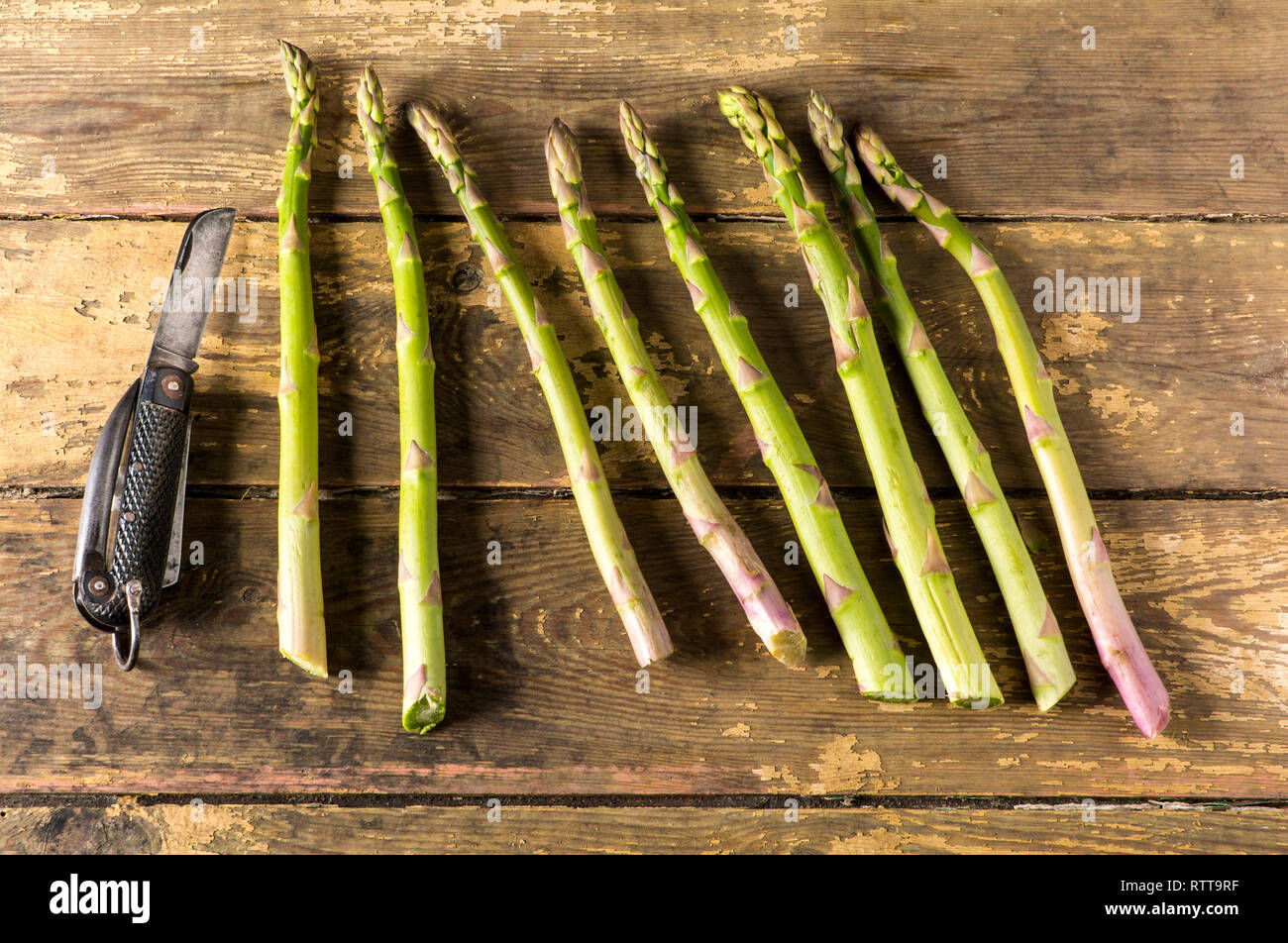 Asparagus tips with knife Stock Photo Alamy