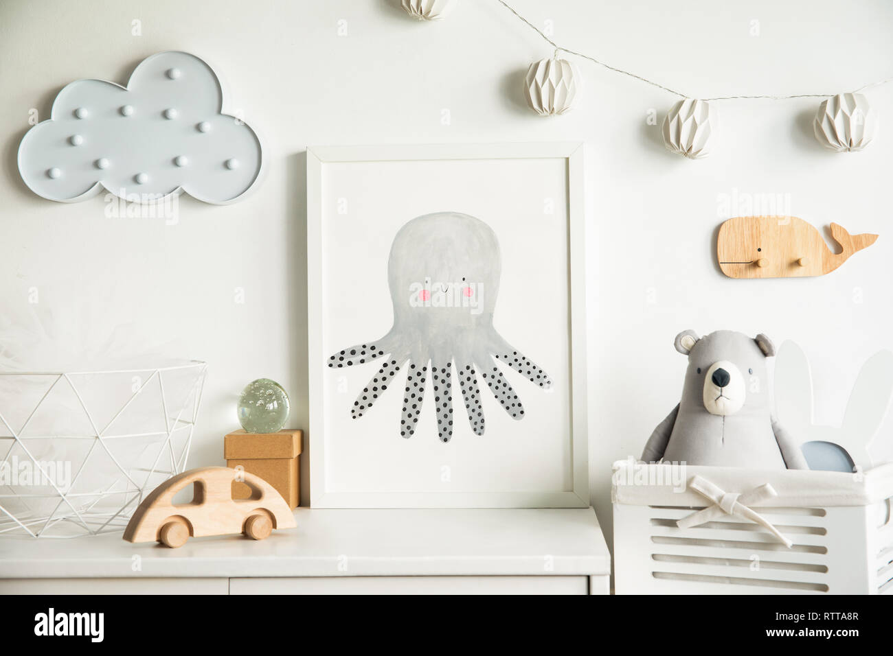 Modern nursery interior with white walls, wooden accessories and toys ...